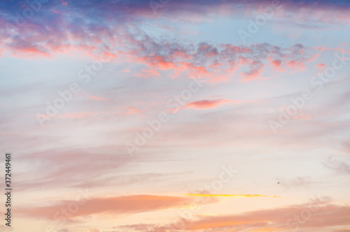Beautiful sky with clouds before sunset. Summer sunset. © Oksana