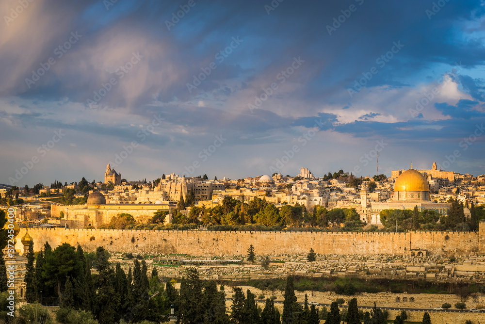 Beautiful morning light over the Old City of Jerusalem: Mount Zion, Jewish Quarter buildings, Hurva synagogue, the Temple Mount with Al Aqsa Mosque and Dome of the Rock; view from Mount of Olives