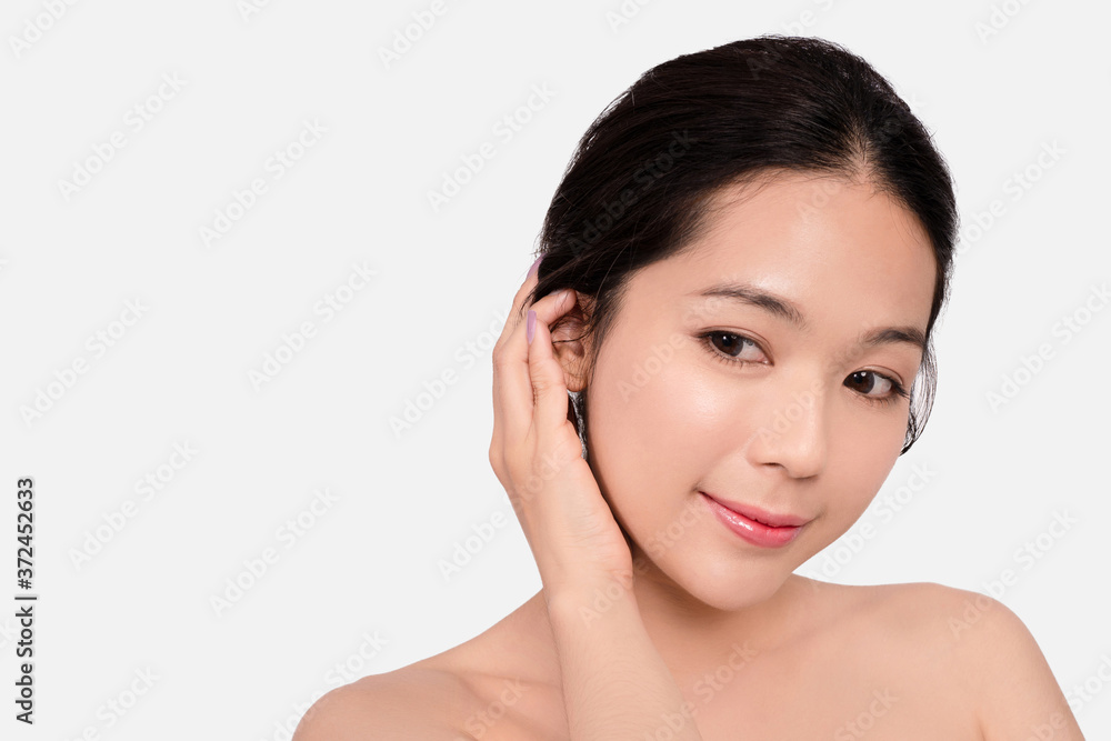 Closeup young woman smiling face with clean skin on a white background.