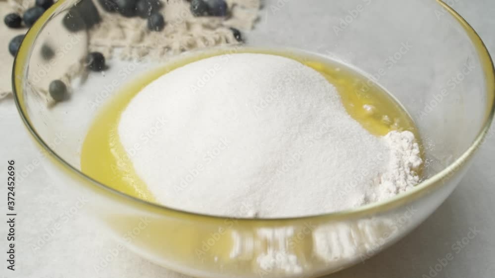 Sugar And Milk Poured Into A Baking Mix, Cooking Preparation Sugar And Milk Poured Into A Baking Mix, Cooking Preparation