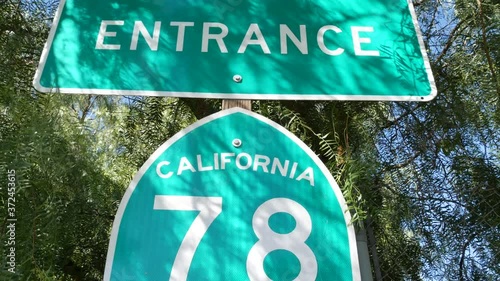 Freeway entrance sign on interchange crossraod in San Diego county, California USA. State Route highway 78 signpost plate. Symbol of road trip, transportation and traffic safety rules and regulations. photo