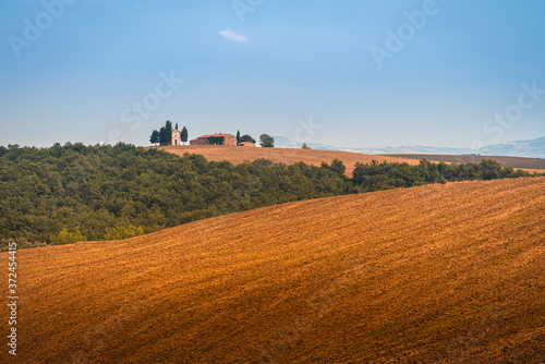 Beautiful sunset over the Tuscany hills and fields. Travel destination Tuscany