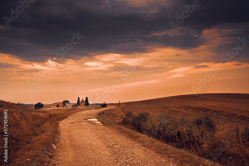 Beautiful sunset over the Tuscany hills and fields. Travel destination Tuscany