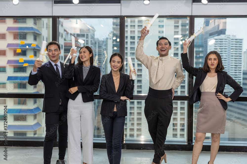 Naklejka premium Business office workers celebrate a great acheivement together after major effort. Award of great success by working together in a business office. Moment of appreciation with team sprite