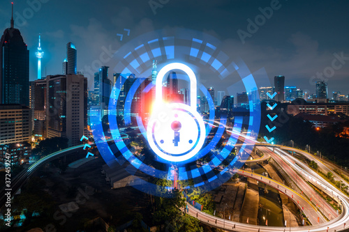 Photography Glowing Padlock hologram, night panoramic city view of Kuala Lumpur, Malaysia, Asia