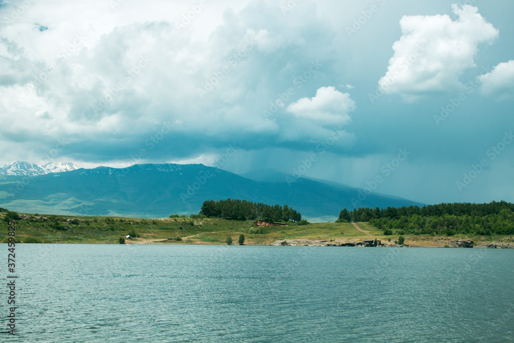 blue reservoir and mountain