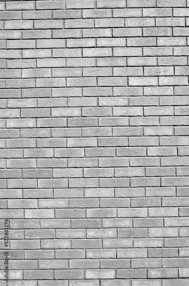 Fototapeta premium New gray decorative brick wall close