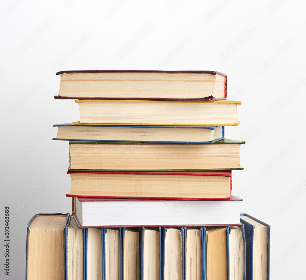 stack of various books, items on a white background stack of various books, items on a white background
