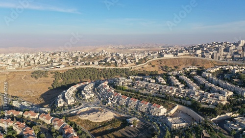 Bild auf Leinwand Israel and Palestine town divided by wall, aerial
pisgat zeev and anata refugees