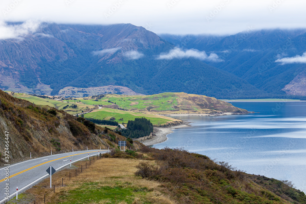 Scenic highway road with Lake Hawea and Mountains Wanaka South Island New Zealand
