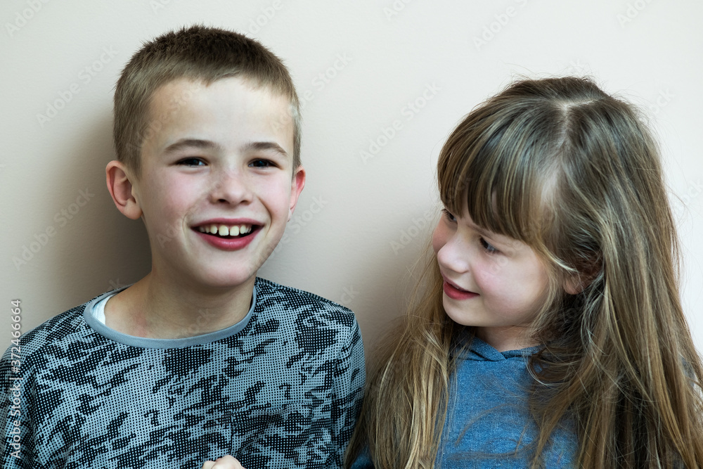 Two children boy and girl fooling around having fun together. Happy childhood concept. Two children boy and girl fooling around having fun together. Happy childhood concept.
