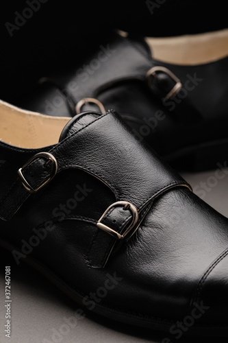 Male classic shoes. Elegant black monk shoes