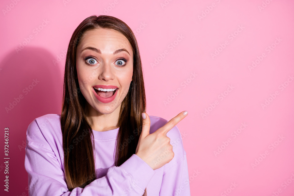 Closeup photo of attractive excited lady direct fingers side empty space show novelty banner shopping open mouth wear casual purple sweater isolated pink pastel color background Closeup photo of attractive excited lady direct fingers side empty space show novelty banner shopping open mouth wear casual purple sweater isolated pink pastel color background