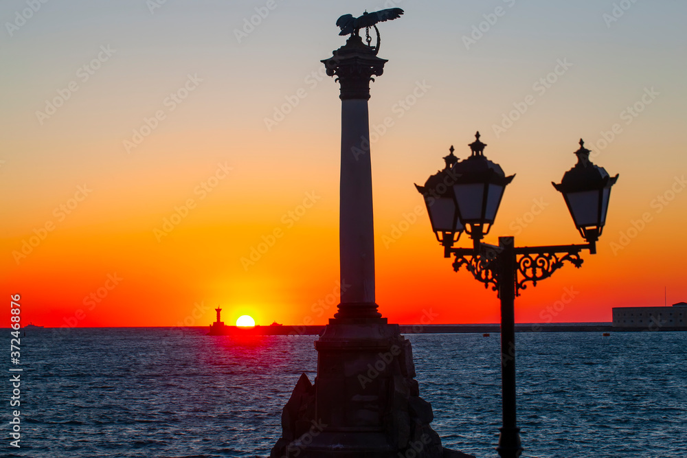 The sunset on the embankment of Sevastopol. Selective focus