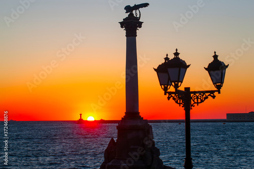 The sunset on the embankment of Sevastopol. Selective focus © bborriss