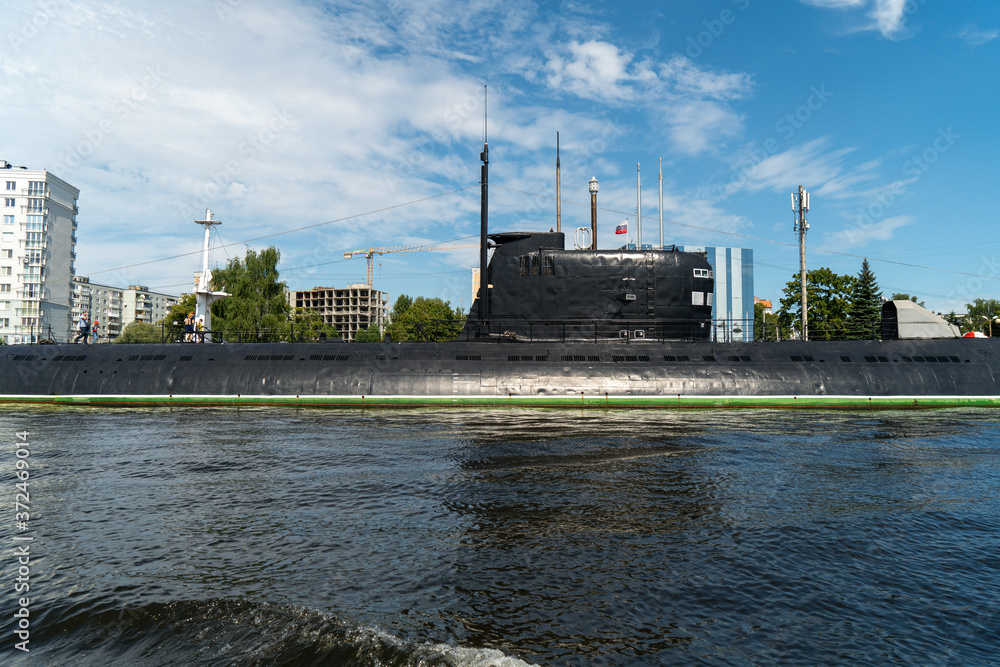 Fototapeta premium black submarine is parked in the port, central part of the boat