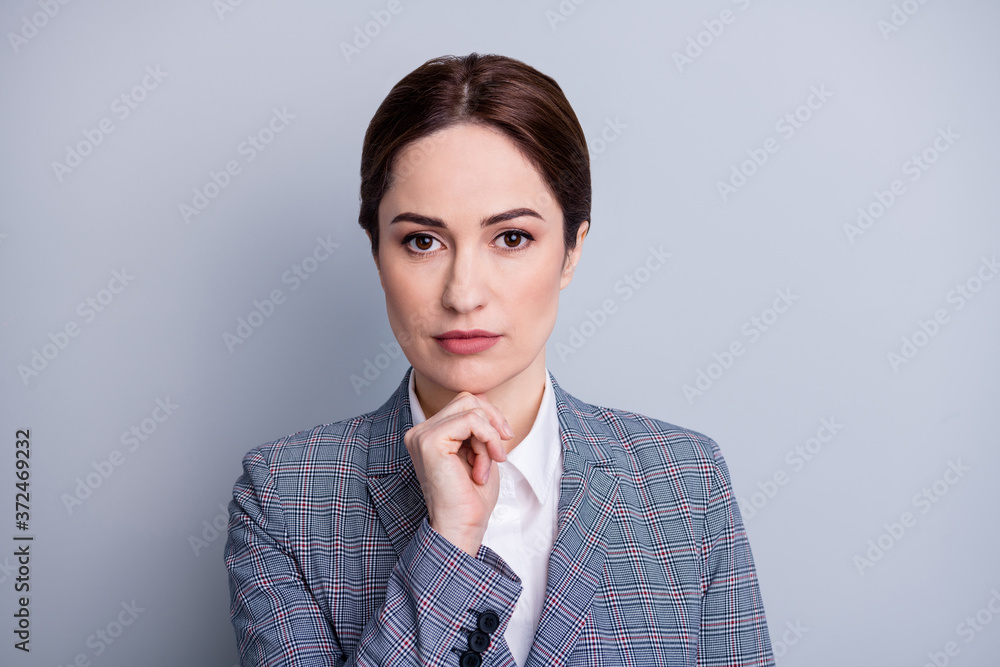 Closeup photo of attractive business lady teacher look interested camera focused hand on chin planning future lesson wear plaid blazer white shirt isolated grey color background Closeup photo of attractive business lady teacher look interested camera focused hand on chin planning future lesson wear plaid blazer white shirt isolated grey color background