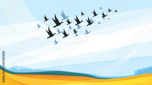 Migratory birds in blue sky. Beautiful nature scenery.