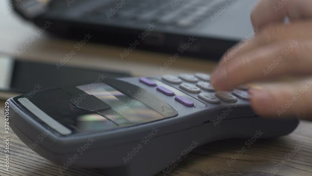 Close-up shot of man applies smartphone to terminal performing successful contactless payment. Close-up shot of man applies smartphone to terminal performing successful contactless payment.
