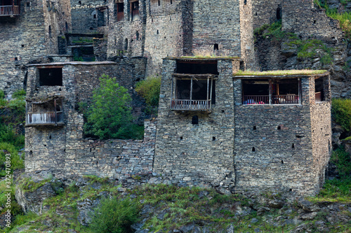 Old Fortress in mountain village Shatili, ruins of medieval castle photo