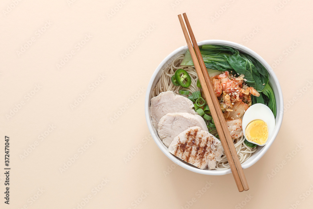 Miso Ramen Asian noodles with egg, chicken, and pak choi cabbage in bowl. Japanese cuisine. Miso Ramen Asian noodles with egg, chicken, and pak choi cabbage in bowl. Japanese cuisine.