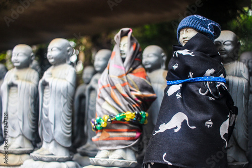 Jizo Statues at a Buddhist shrine in Japan photo