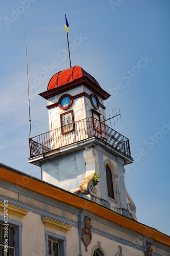 Leaning tower of historical town hall in Kuty, Ivano-Frankivsk region, Ukraine at sunny summer morning