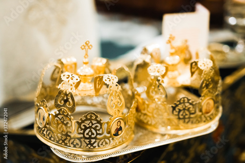 Golden crowns lying on the table in church