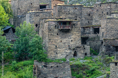 Old Fortress in mountain village Shatili, ruins of medieval castle photo