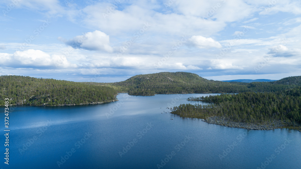 Beautiful lake and green forest at bright day. Aerial panorama. Beautiful lake and green forest at bright day. Aerial panorama.