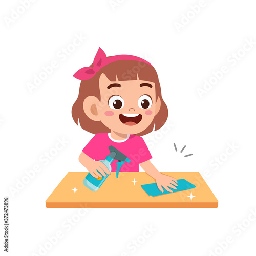 happy cute little kid boy and girl do chores cleaning table