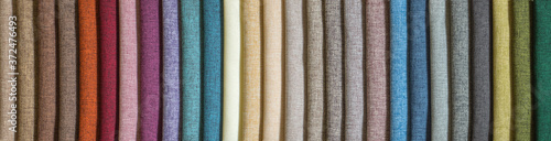 Various samples multicolored natural fabric background. Wide selection textiles. Long banner