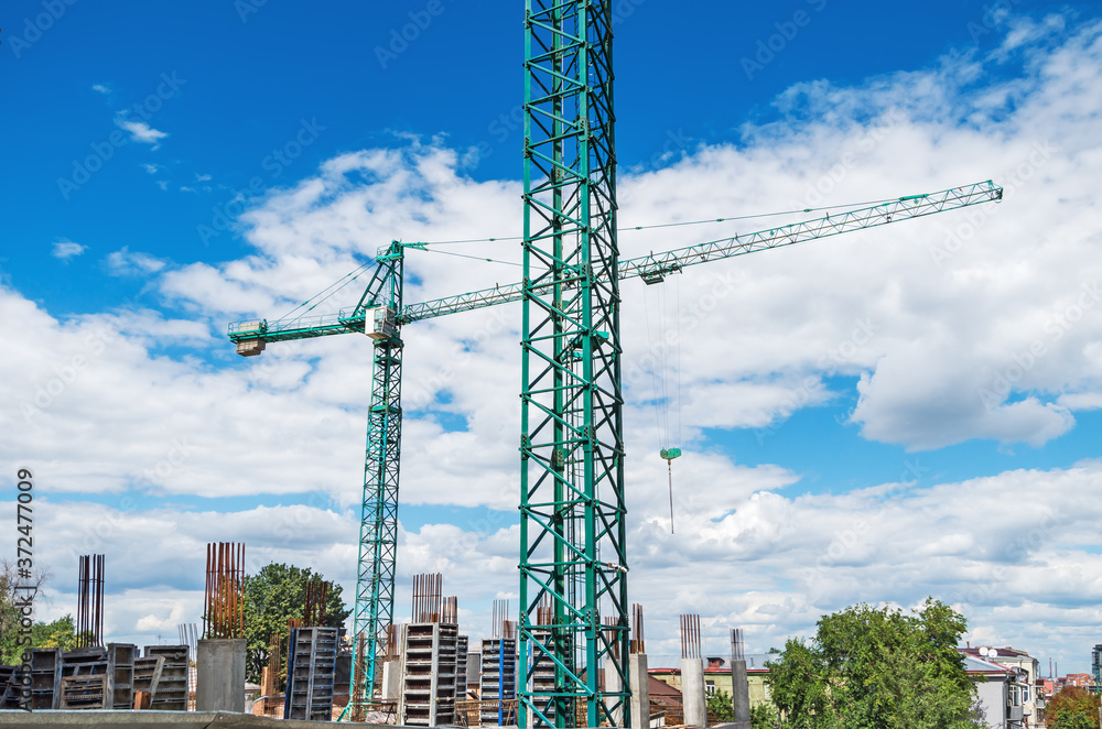 Obraz premium Two tower cranes