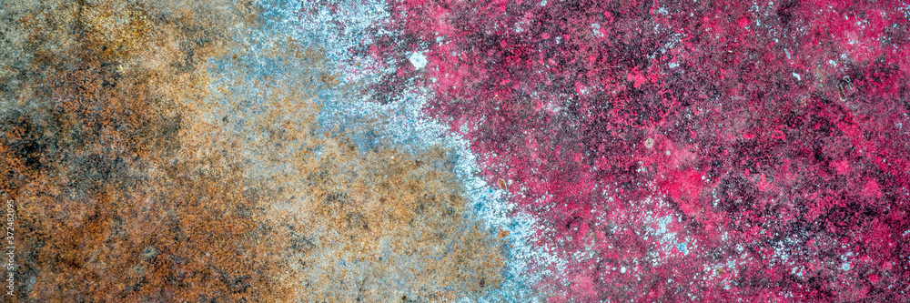 red and blue grunge painted metal texture of junk car body, panoramic web banner