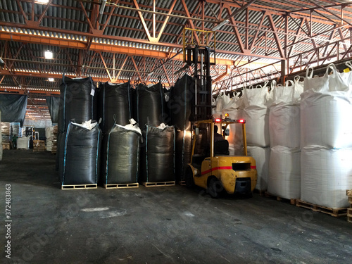 Chemical fertilizer Urea Stock pile jumbo-bag in warehouse waiting for shipment.