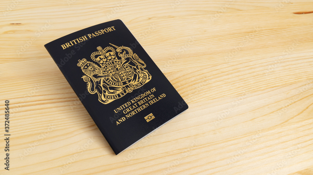 London, UNITED KINGDOM - AUGUST 17, 2020: New UK Passport Edition released in March 2020 after Brexit laid on desk, citizenship newsworthy London, UNITED KINGDOM - AUGUST 17, 2020: New UK Passport Edition released in March 2020 after Brexit laid on desk, citizenship newsworthy