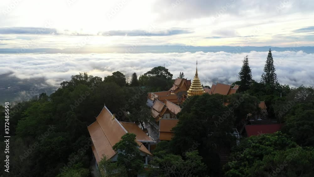 Aerial view at Wat Phra That Doi Suthep temple on the Clouds with Sunrise in Chiangmai, Thailand. Aerial view at Wat Phra That Doi Suthep temple on the Clouds with Sunrise in Chiangmai, Thailand.
