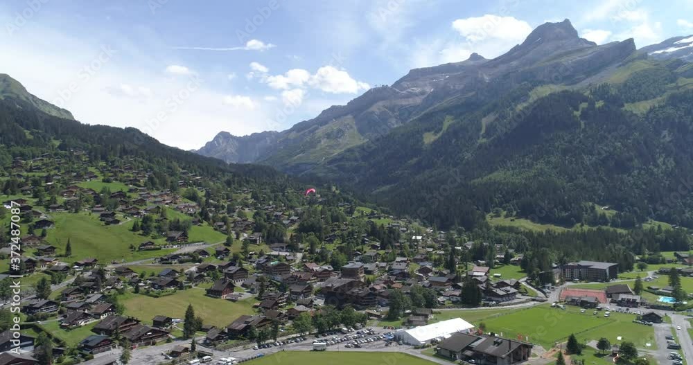 Diablerets village with paraglider - Aerial 4K Diablerets village with paraglider - Aerial 4K