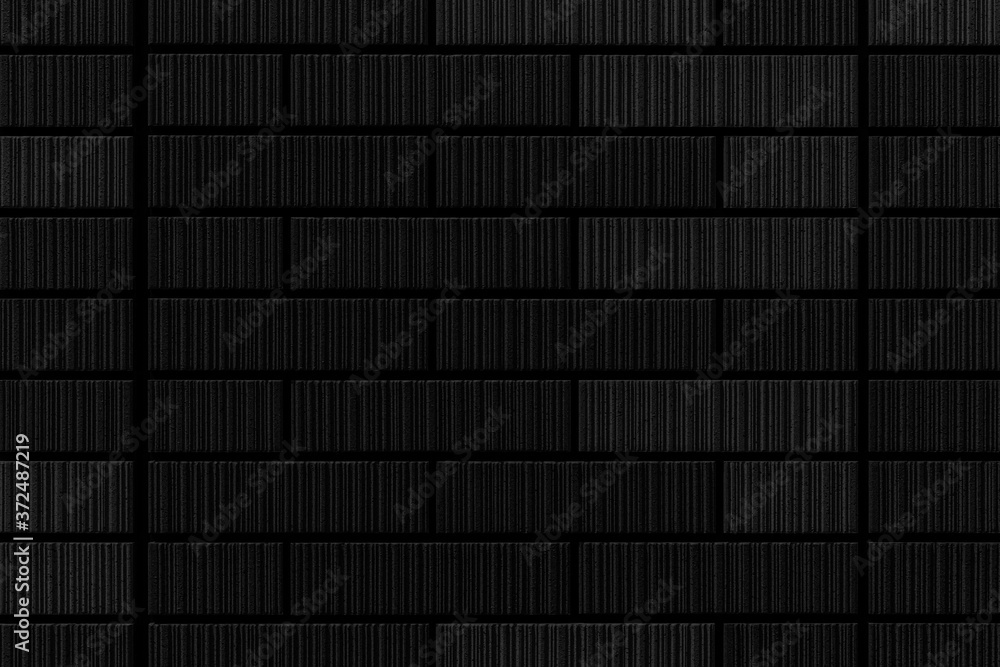 Black stone brick wall texture and seamless background Black stone brick wall texture and seamless background