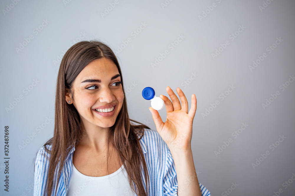 Woman Thinking to Choose Contact Lenses Over Eyeglasses. Girl considering the advantages and disadvantages of wearing contacts. Woman with Contact Lenses Case Woman Thinking to Choose Contact Lenses Over Eyeglasses. Girl considering the advantages and disadvantages of wearing contacts. Woman with Contact Lenses Case