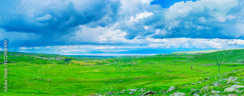 The clouds over green meadows, Selim pass, Gegharkunik Province, Armenia photo