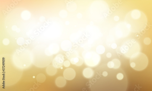 Gold glittering background with bokeh effect. Golden twinkled light backdrop for Wedding or Christmas xmas card