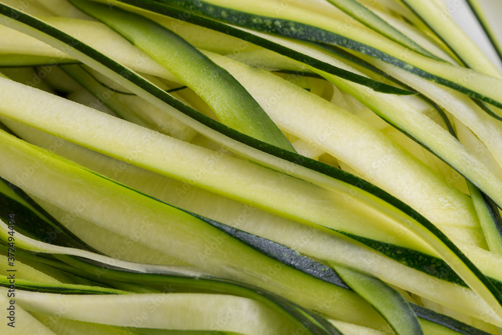 Fototapeta premium green sliced zucchini, courgette closeup selective focus