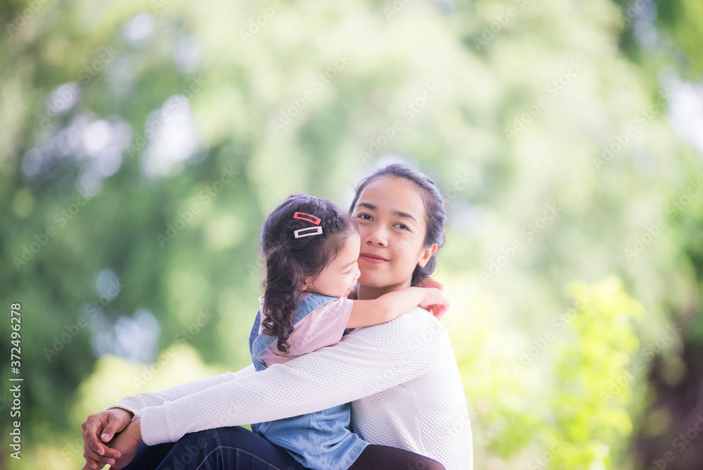 Portrait of happy loving mother and her baby outdoors, Asian girl lifestyle. Asia mother's day concept Portrait of happy loving mother and her baby outdoors, Asian girl lifestyle. Asia mother's day concept
