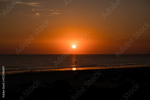 Sunset at La Barrosa beach in Sancti Petri, Cadiz, Spain