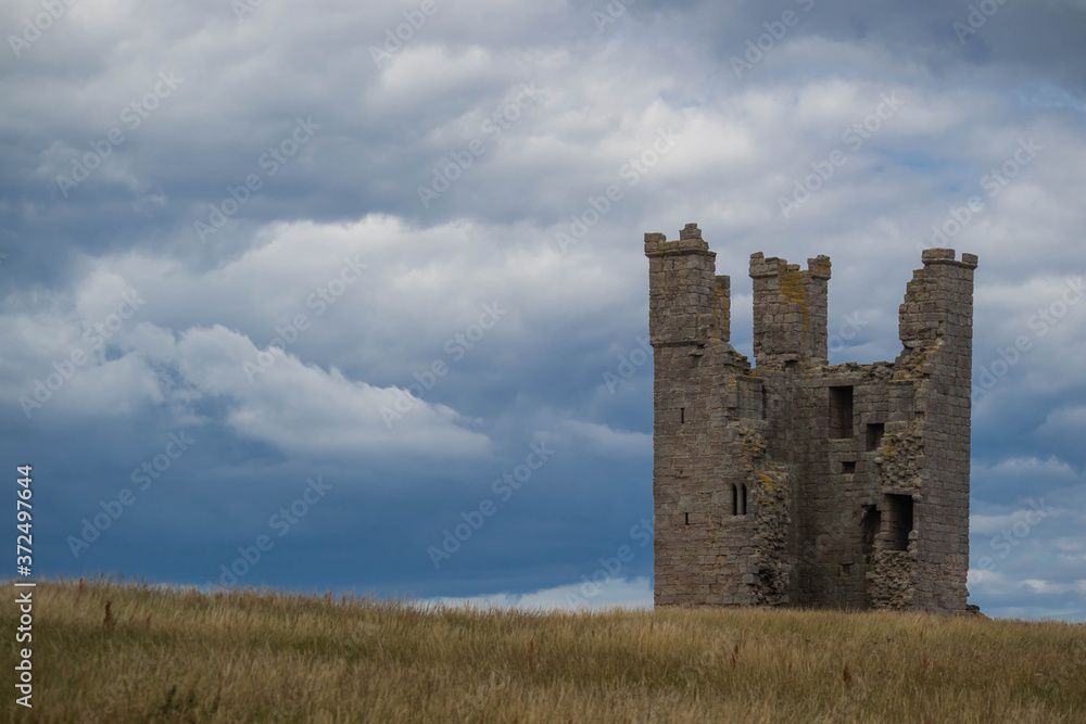 Dunstanburgh Castle on the shores of Northumbria, UK
