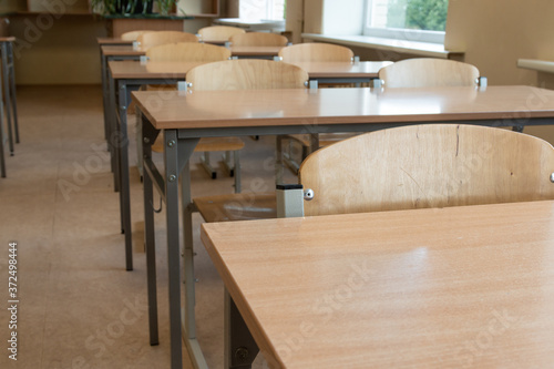 Chair in classroom. School desk in emty school classroom.
