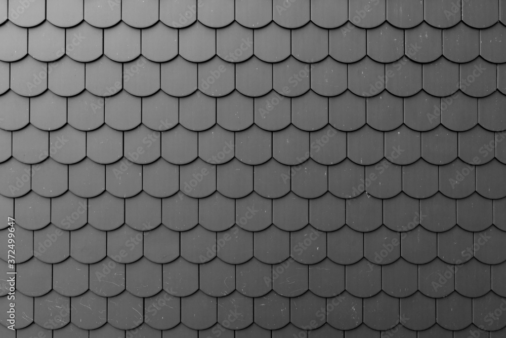Fragment of a black roof of a private house made of shingles - obrazy, fototapety, plakaty 