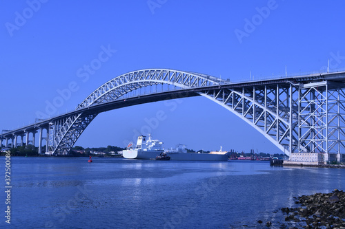 Bayonne Bridge with ship going under it © Charles
