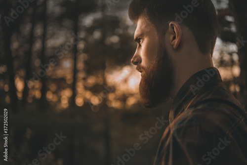 Portrait of bearded man confidently looking forward